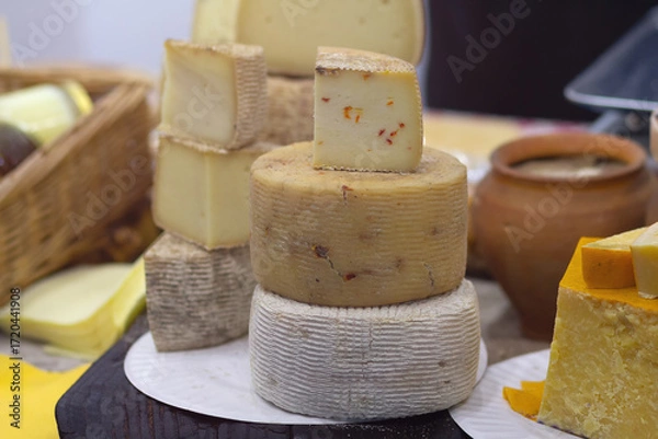 Fototapeta Cheese on the counter of the store