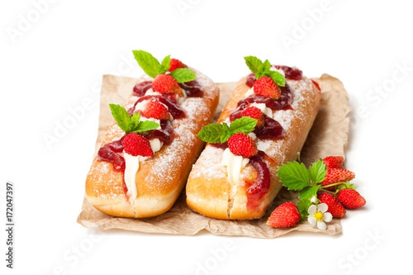 Fototapeta Custard  filled doughnuts with wild strawberry isolated on white