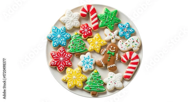 Fototapeta A plate full of assorted christmas decorated cookies including gingerbread men, candy canes, and trees, isolated on transparent background