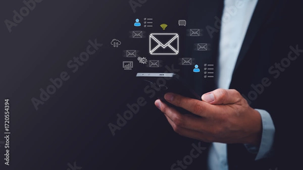 Fototapeta Businessman using smartphone with floating email and communication icons, representing digital marketing, email campaign, online messaging, business communication, CRM, and cloud technology services.