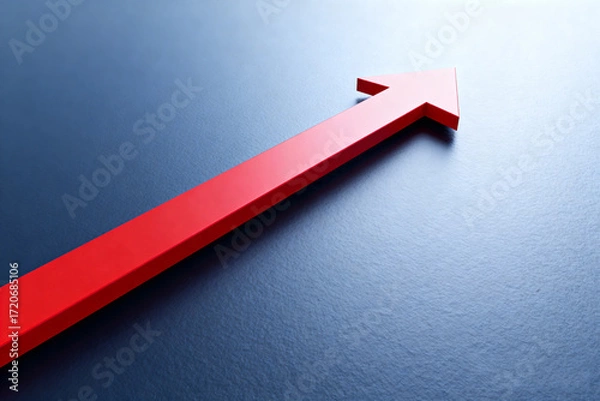 Fototapeta a bright red arrow pointing upwards on a clean white background, symbolizing growth, progress, success, development, improvement, positive change, upward trend, advancement, achievement.