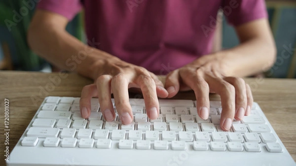 Fototapeta Hands man typing on white keyboard.