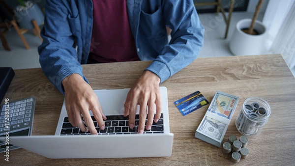 Fototapeta Business man saving money accountant financial analyst and auditor working and laptop for calculating