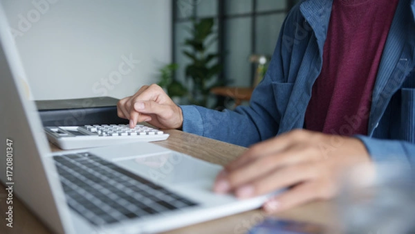 Fototapeta Business man accountant financial analyst and auditor working and laptop for calculating 