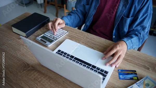 Fototapeta Business man accountant financial analyst and auditor working and laptop for calculating 