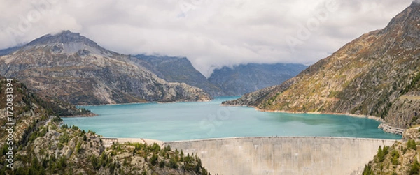 Fototapeta Aerial panoramic view of Emosson Dam and Lake in the Swiss Alps, renewable hydropower reservoir and mountain landscape, sustainable clean energy infrastructure