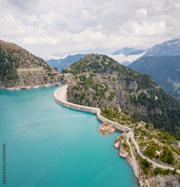 Fototapeta Aerial panoramic view of Emosson Dam and Lake in the Swiss Alps, renewable hydropower reservoir and mountain landscape, sustainable clean energy infrastructure