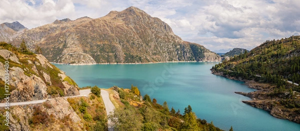 Fototapeta Aerial panoramic view of Emosson Dam and Lake in the Swiss Alps, renewable hydropower reservoir and mountain landscape, sustainable clean energy infrastructure