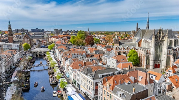 Fototapeta Leiden town aerial drone view from above, typical Dutch city skyline with canals and houses, Leiden architecture, South Holland, the Netherlands