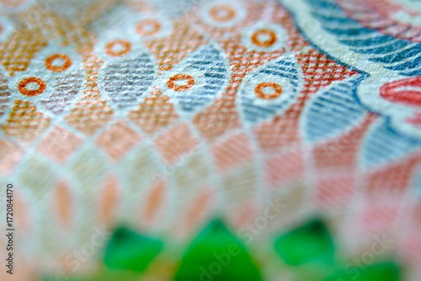 Fototapeta Close-up View of Intricate Colorful Artwork on Currency Note