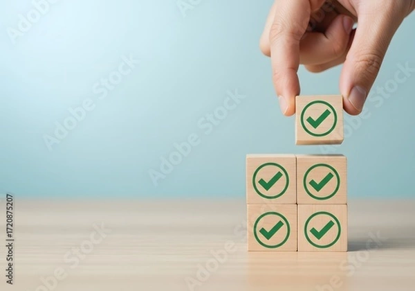 Obraz Hand placing final checkmark block completing a successful task completion concept