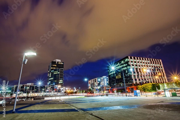 Fototapeta a beautiful view of Melbourne city around dockland with a cloudy sky and twilight in Melbourne Australia.