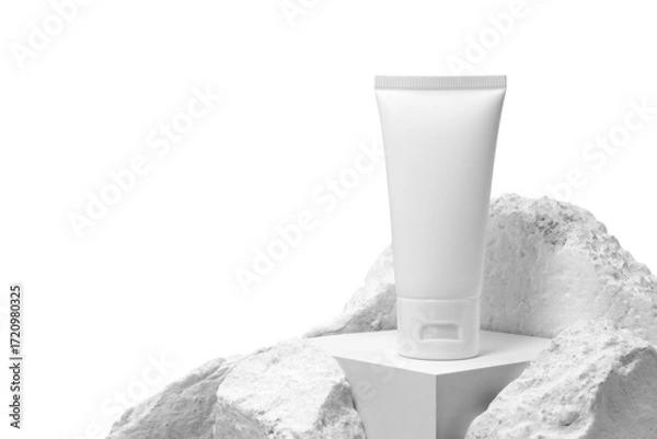 Fototapeta White plastic cream tube with stone for mockup isolated on white background. Selective Focus.