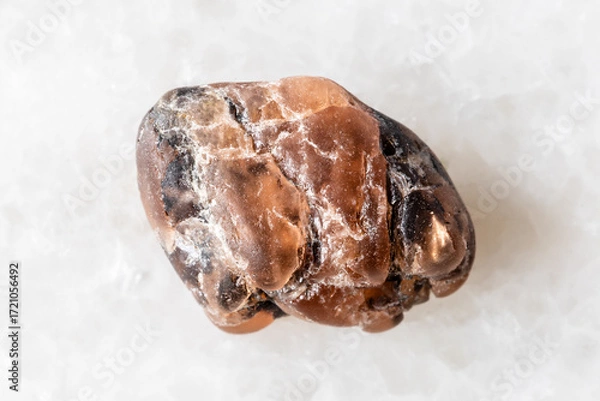 Obraz sample of rough triplite mineral on white marble