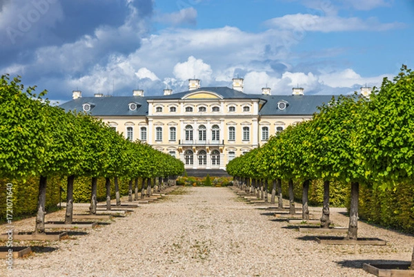 Fototapeta Rundale Palace - Baroque architecture with tree lined alley in the formal gardens, Latvia