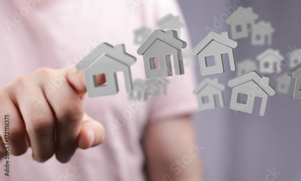 Fototapeta Hand points at a digital house icon, symbolizing real estate, property, home selection or purchase.