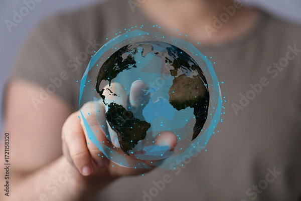 Fototapeta High-quality stock photo of a hand interacting with a digital globe, representing global connection and technology.