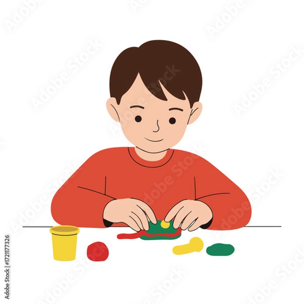 Fototapeta Boy playing with colorful modeling clay on a white table