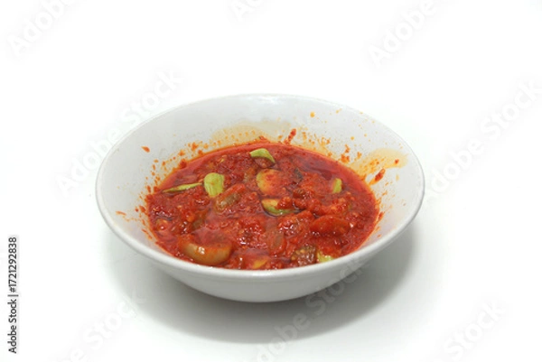Fototapeta close up of petai beans in sambal sauce food background, with copy space. Perfect for recipe, article, or any cooking contents