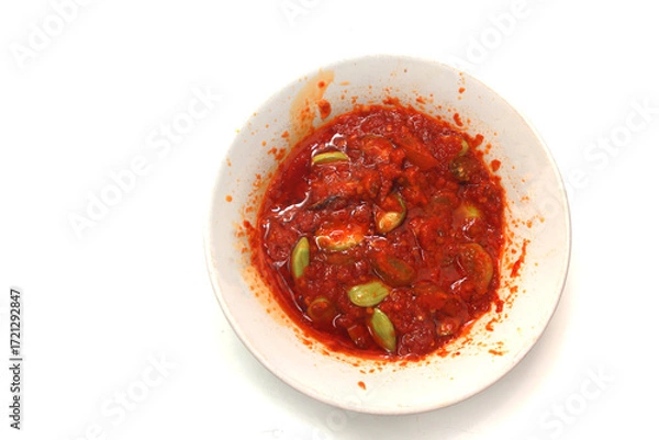 Fototapeta close up of petai beans in sambal sauce food background, with copy space. Perfect for recipe, article, or any cooking contents
