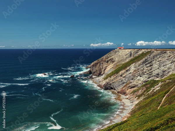 Fototapeta Ocean landscape with a lighthouse in the distance on a summer day