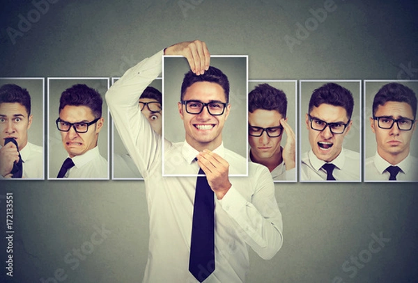 Fototapeta Masked young man in glasses expressing different emotions