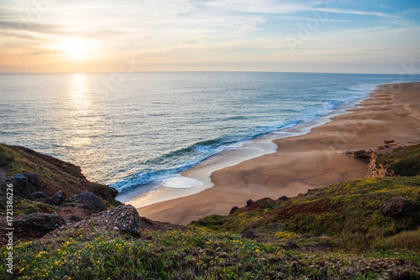 Fototapeta Golden Sunset Over Atlantic Waves on the Sandy Beach of Nazare, Portugal Coastline