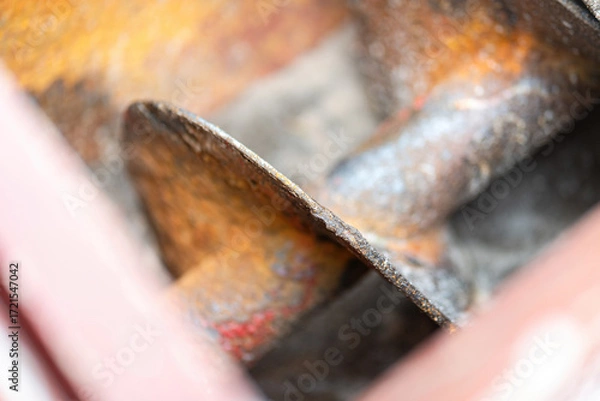 Fototapeta Close-up at turning screw part of the chemical blender machine. The equipment that using to feed and blending the chemical. Industrial equipment object, selective focus.