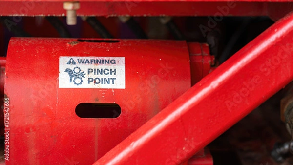 Fototapeta "Pinch point warning sign" hand and finger injury prevention alert that showed on the industrial equipment such as blender, pumping or milling machine. Safety sign in unsafe working place, close-up.