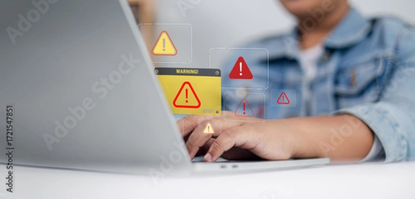 Fototapeta Cybersecurity Warning Alert on Laptop Screen, System Error and Online Threat Notification