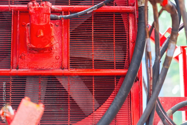 Fototapeta Ventilate fan part of the electricity  generator engine, using to cooling the temperature inside the machine. Industrial equipment object, close-up and selective focus. 