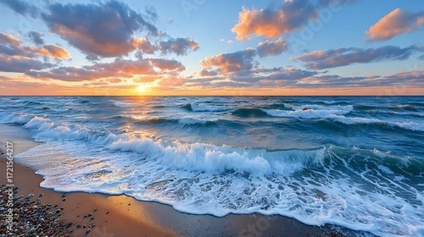 Fototapeta Dramatic Golden Sunset Over Ocean Waves with Colorful Sky at Dusk