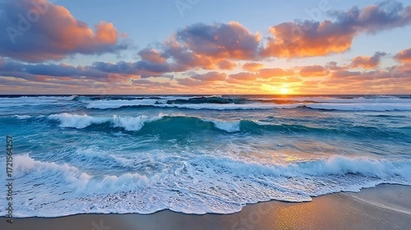 Fototapeta Dramatic Sunset Over Ocean Waves With Golden Sky and Colorful Clouds