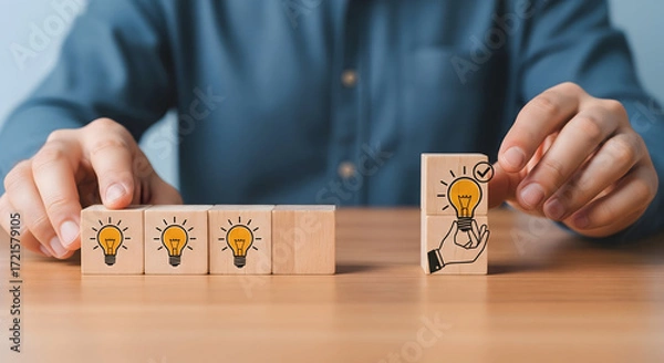 Fototapeta Brilliant ideas emerging with creative lightbulb concepts on wooden blocks