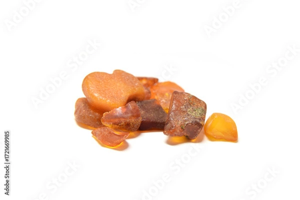 Fototapeta Amber stone  rough unpolished closed up isolated on white 