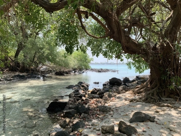 Fototapeta A tranquil coastal scene, featuring a lush tropical shoreline with a large, ancient tree casting shade over a sandy beach.