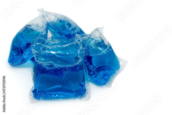 Fototapeta A blue laundry detergent capsule on a white background. Washing machine capsule isolate.