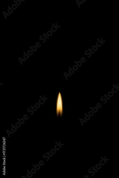 Fototapeta Single glowing candle on soft green backdrop—serene minimal image for memorials, prayer cards, vigils, and calming designs.