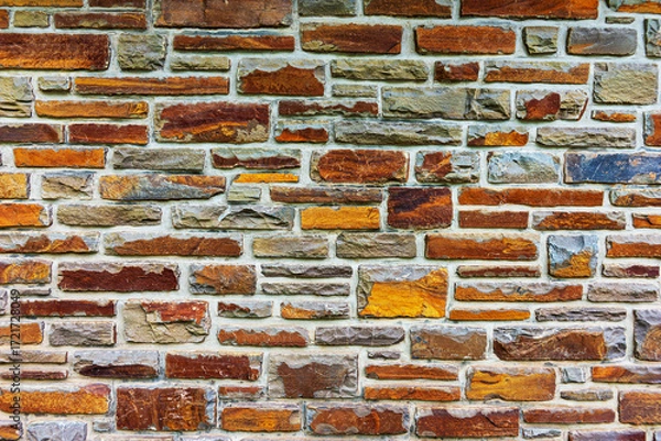 Fototapeta Colorful stone wall useful for backgrounds. Stone wall texture