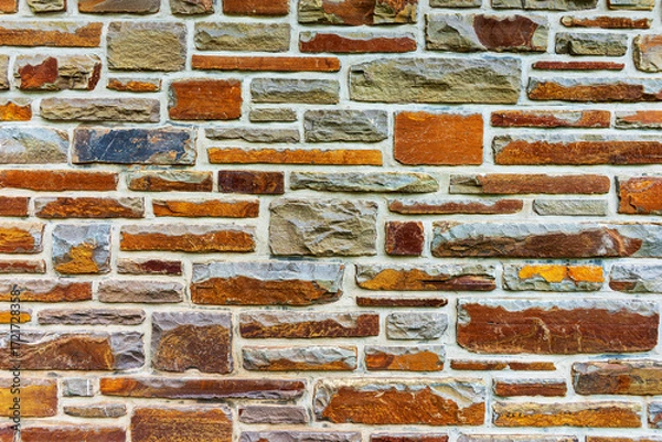 Fototapeta Colorful stone wall useful for backgrounds. Stone wall texture
