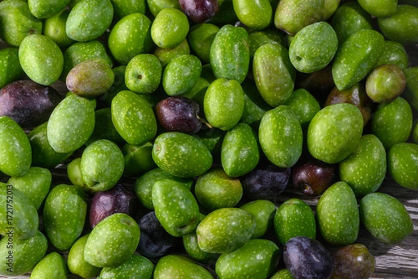 Fototapeta Green olives on table closeup macro shot background