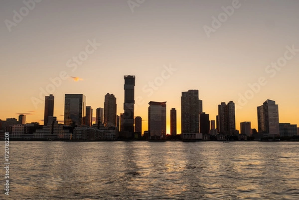 Fototapeta Silhouette of Hoboken, New Jersey from the water.