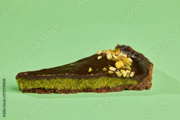 Fototapeta Indulge in the Delicious and Decadent ChocolatePistachio Tart Set Against a Vibrant Background
