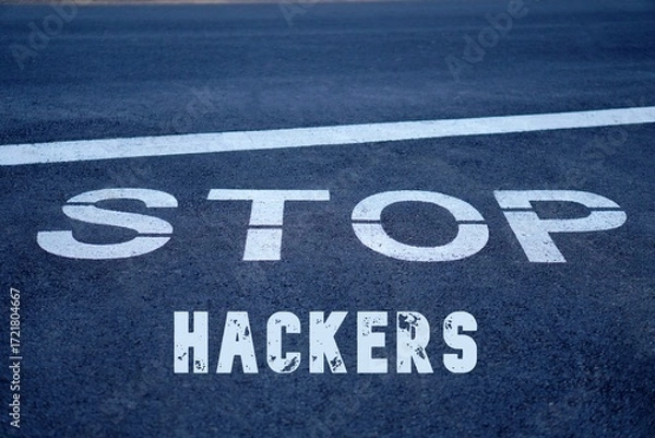 Fototapeta stop hackers. words written on the pavement, on a traffic sign