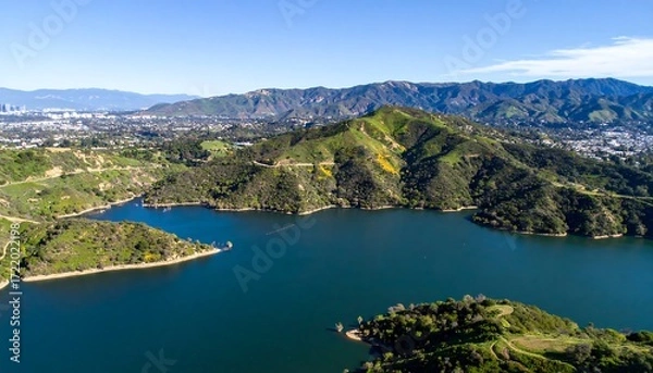 Fototapeta Aerial view of a reservoir nestled in mountains