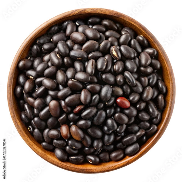 Fototapeta A top down view of a wooden bowl filled with dark black beans isolated on transparent background