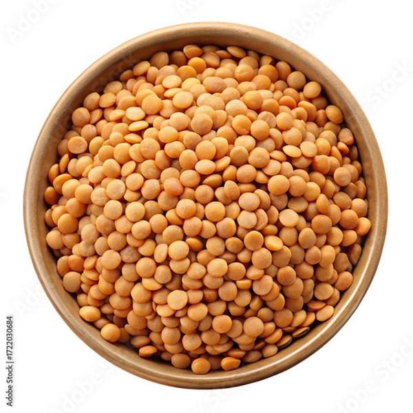 Fototapeta A top down view of a wooden bowl filled with dry red lentils isolated on transparent background