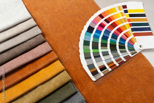 Fototapeta Fabric swatches with color palette samples for upholstery, home decor, and modern textile interior design projects.