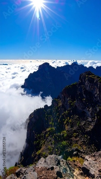 Obraz Mountain peak above clouds