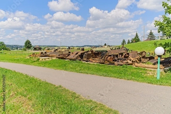 Fototapeta  Minsk region, Belarus, July 12, 2025. Rusty wreckage of old military equipment on the Stalin Line.                              